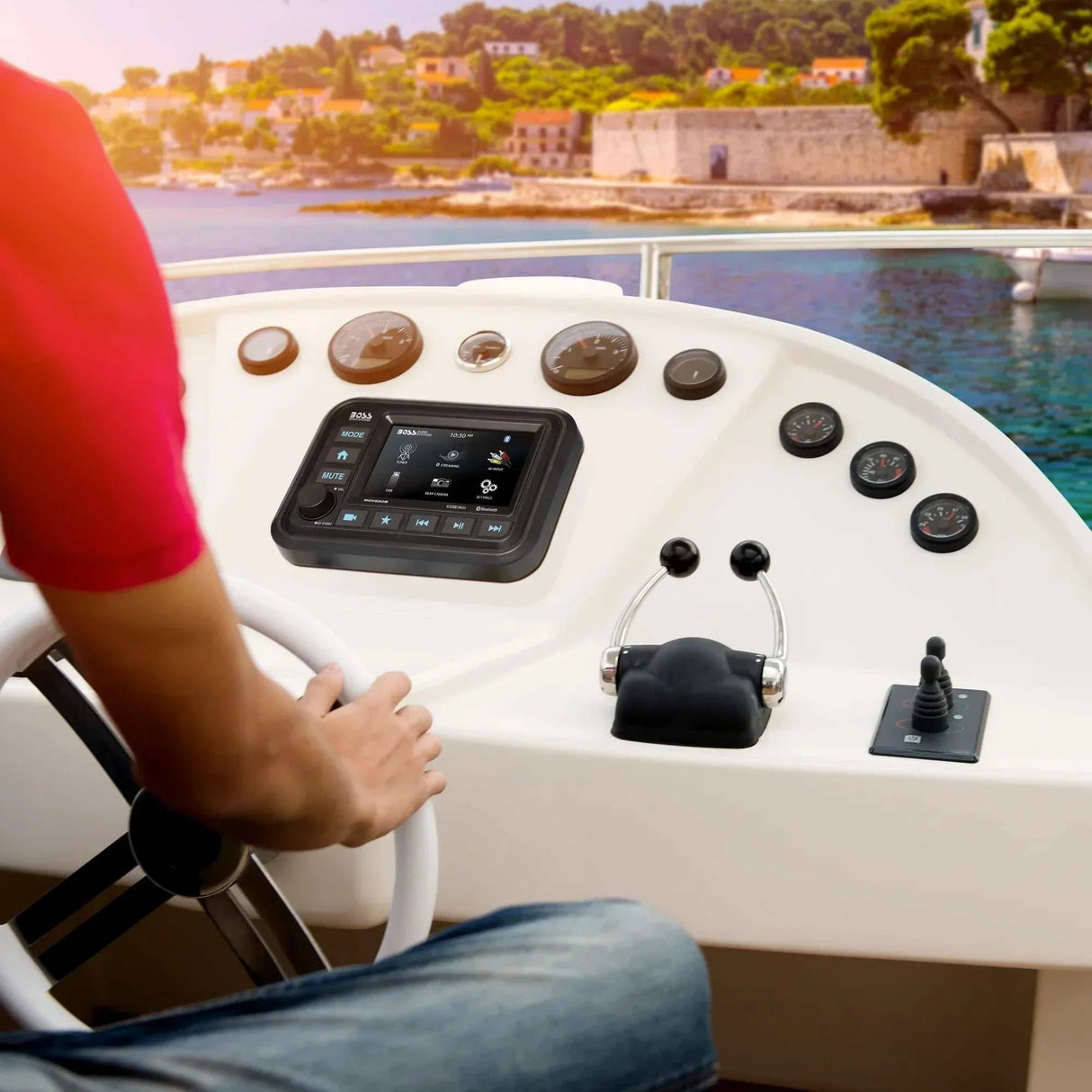 Boss Audio MGV550B marine gauge digital media AM/FM receiver installed on boat dashboard with touchscreen display