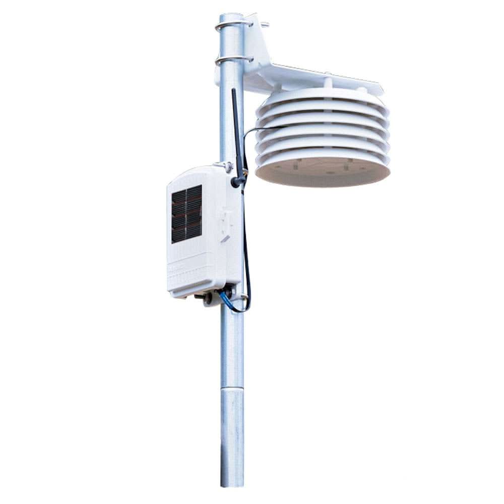 Davis Temperature/Humidity Sensor with 24-Hour Fan Aspirated Radiation Shield mounted on pole with solar panel and cable