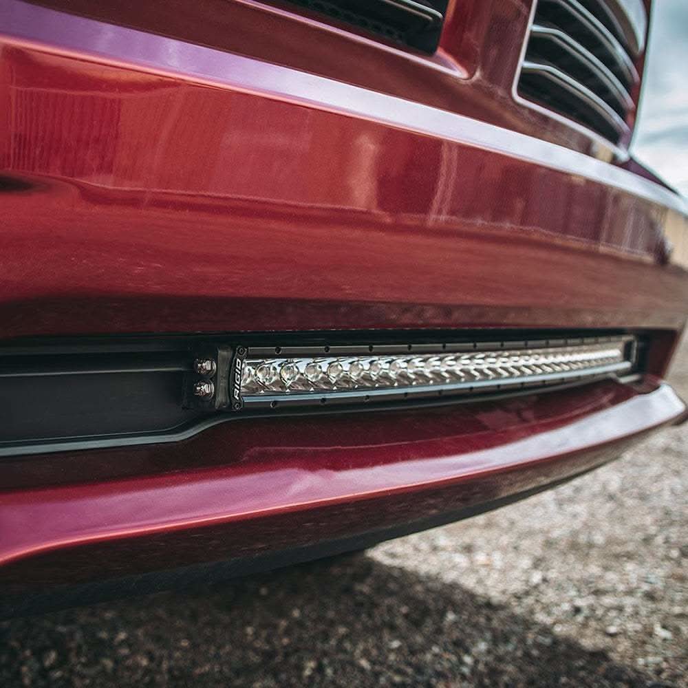 RIGID Industries 2013-2018 RAM 1500 black bumper mount with 30" LED lightbar installed on red truck