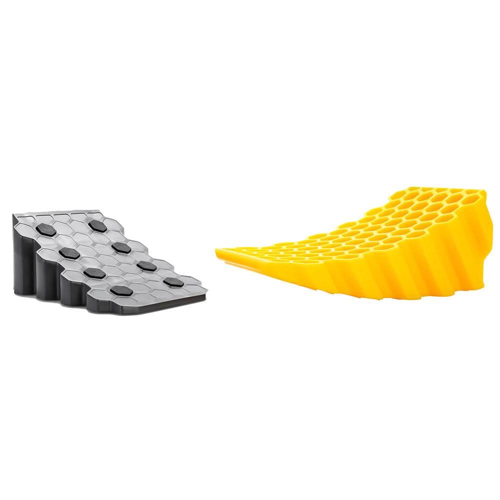 Camco Curved Leveler and Wheel Chock with honeycomb design and non-slip rubber grippers for vehicle leveling up to 4 inches.