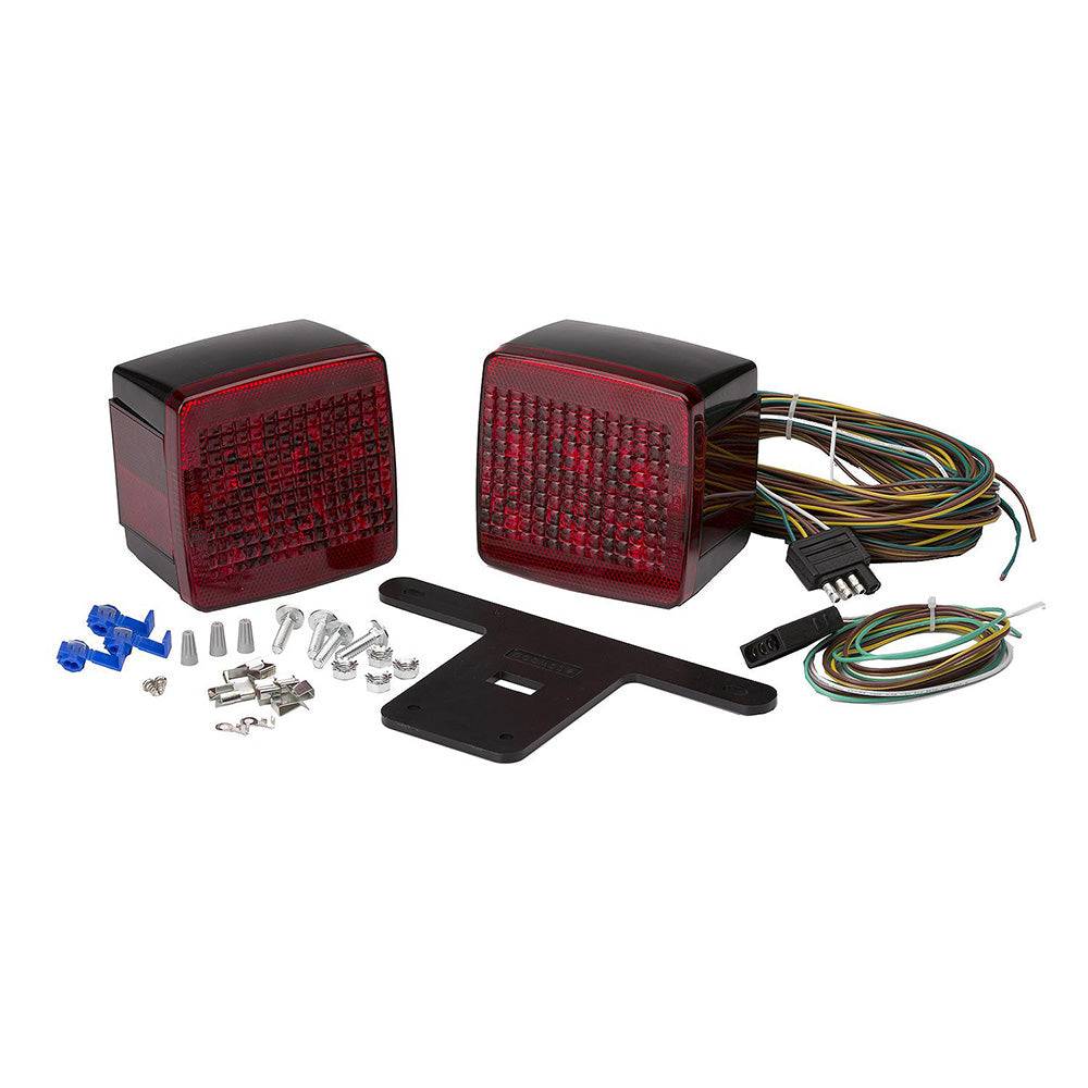 Attwood Submersible LED Trailer Light Kit with two red lights, license plate bracket, wiring harness, and installation hardware for trailers under 80 inches wide