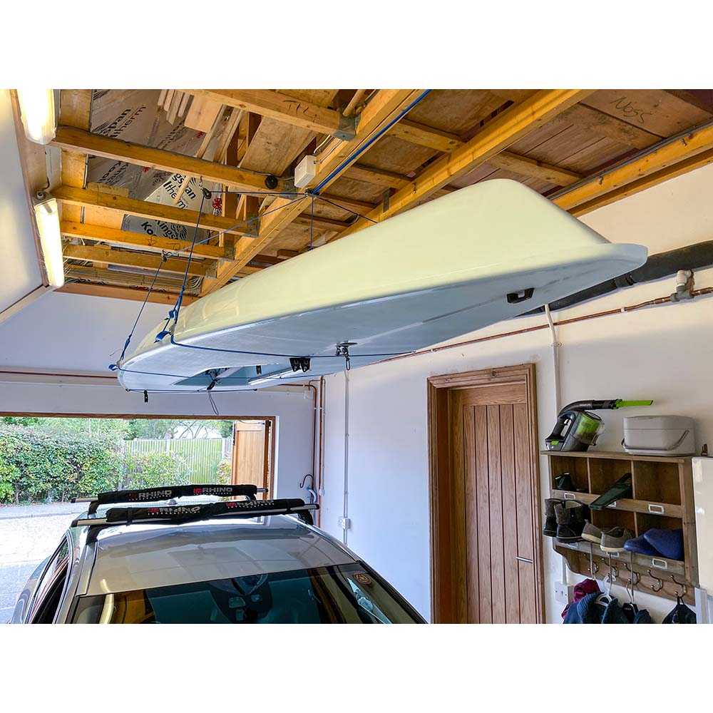 Barton Marine SkyDock Storage System lifting kayak in garage ceiling storage with 3 to 1 reduction and 4-point lift up to 175 lbs