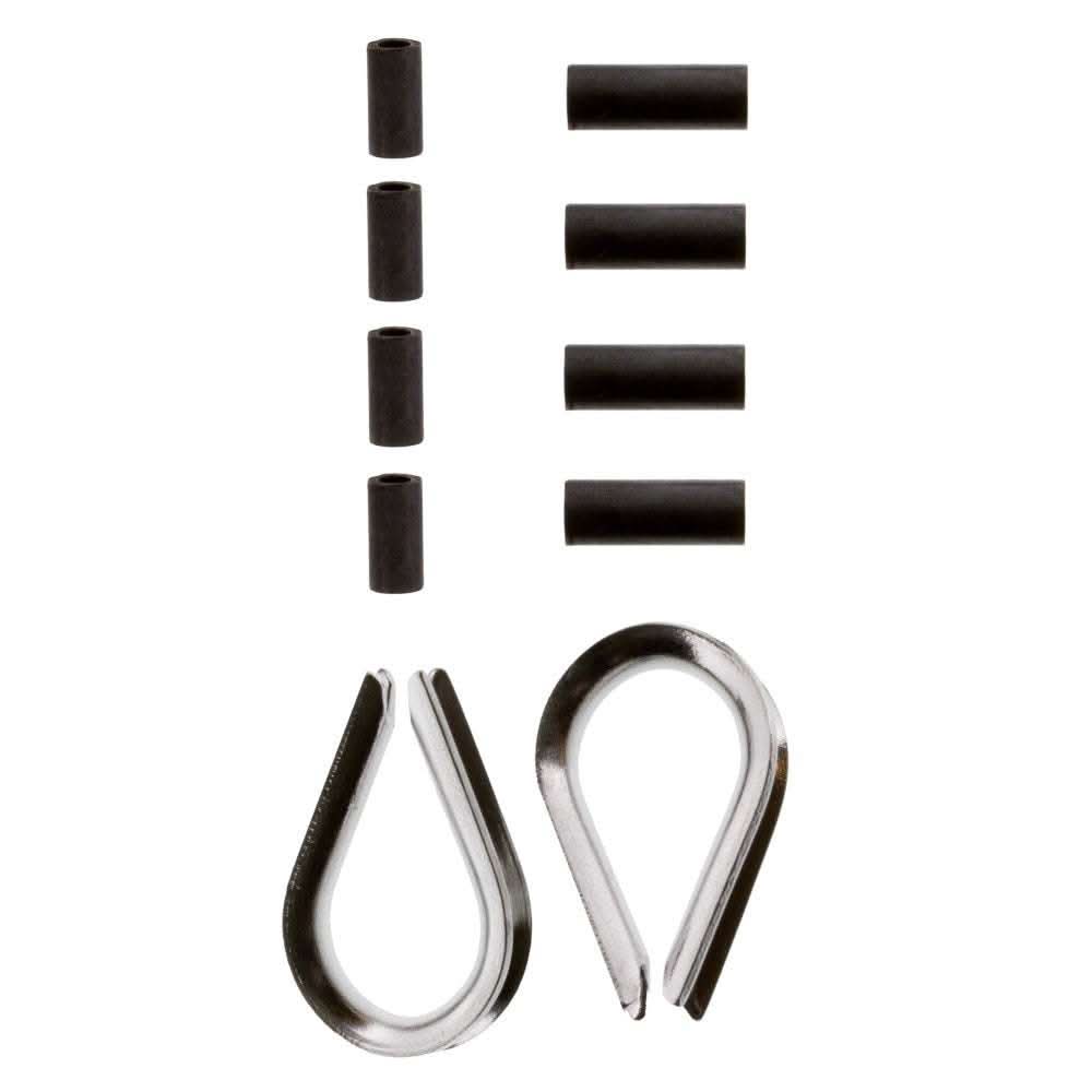 Scotty 1157 stainless steel thimble kit with brass connector sleeves and steel thimbles laid out on white background