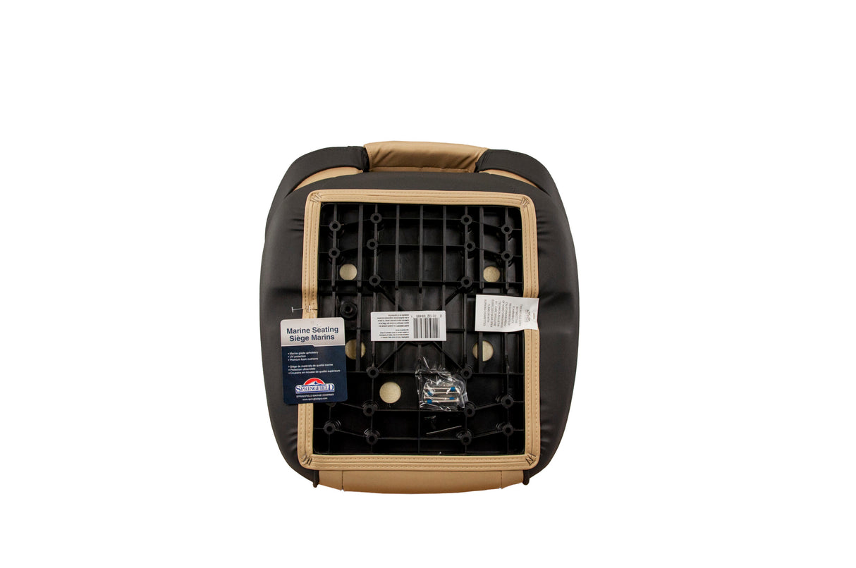 A black and tan car seat cushion shown from the underside, revealing the foam structure, mounting holes, and attached retail tags, set against a plain white background.